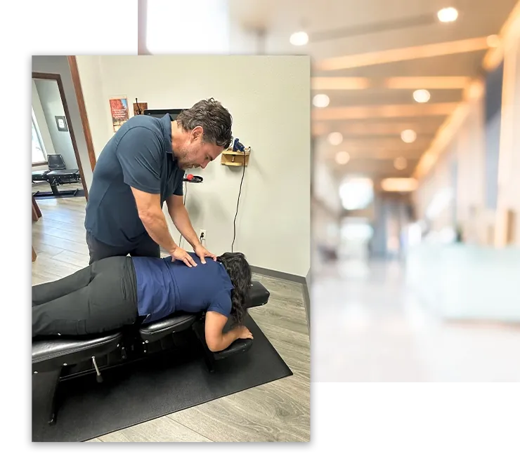 Chiropractor performing spinal adjustment on patient at Boise chiropractic clinic.